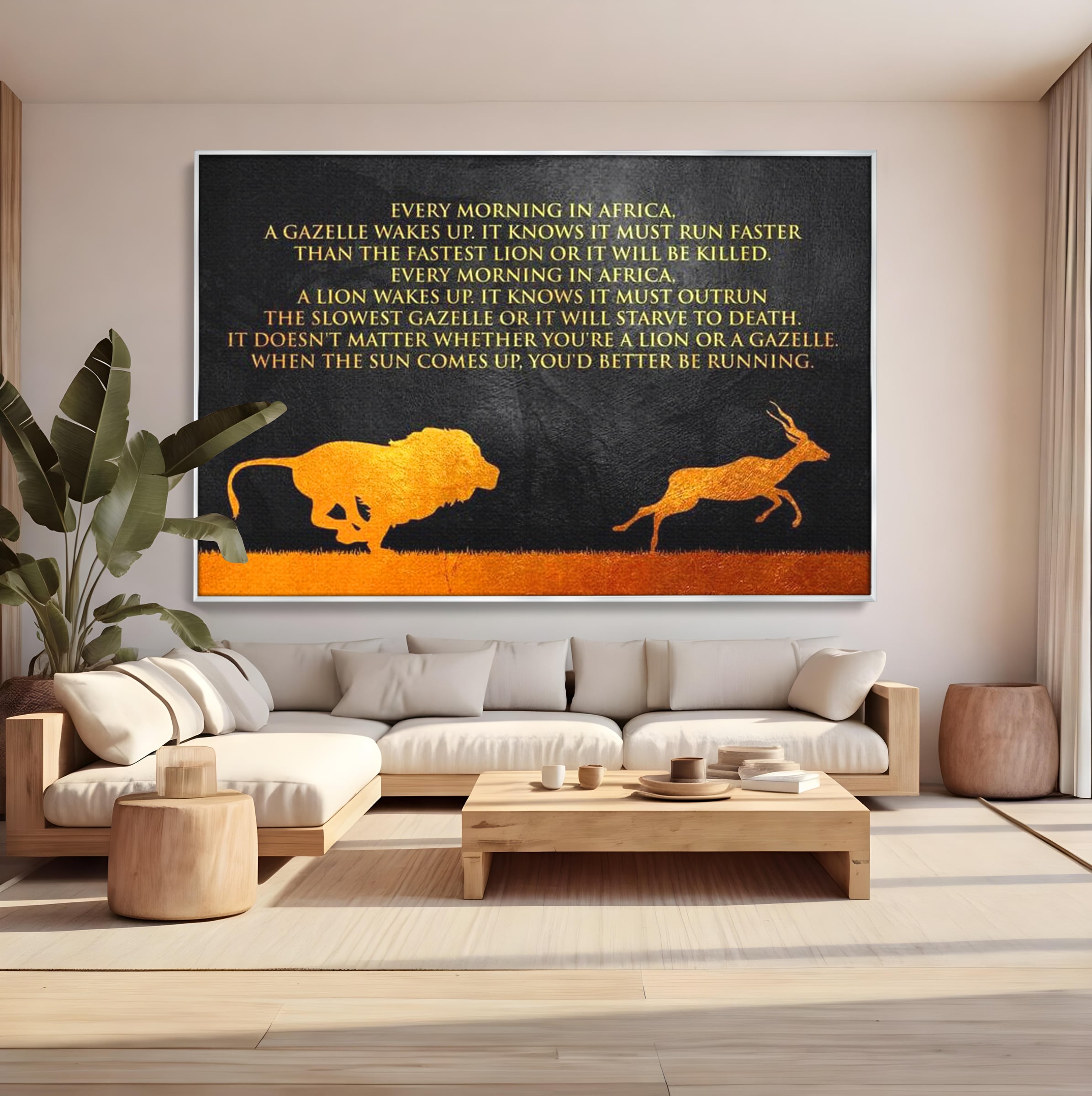 Tablou canvas cu tablou motivational cu leu si gazela, in rama de aluminiu argintiu, pe perete intr-un living